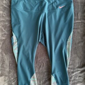 Nike Teal Capri Leggings with Pink Swoosh and Patterned Panels